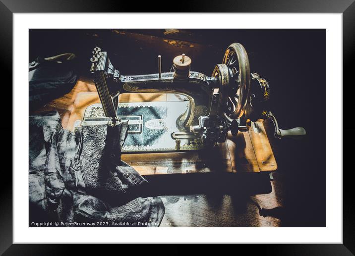 Hand Cranked Vintage Sewing Machine Sunlit On A Wo Framed Mounted Print by Peter Greenway