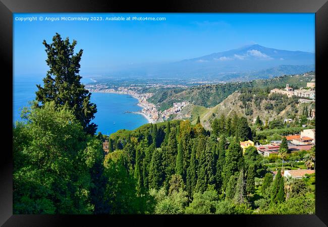View of Mount Etna and east coastline of Sicily Framed Print by Angus McComiskey