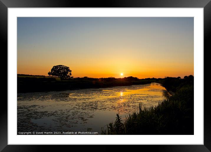 Sunset over the canal. Framed Mounted Print by David Martin