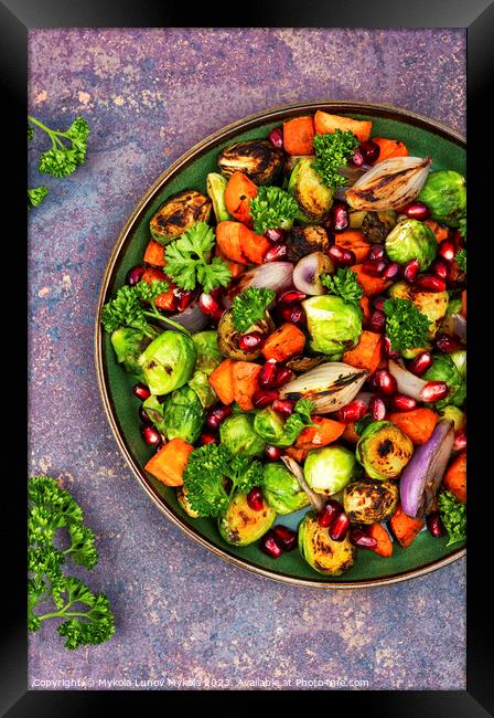 Bright vegetable salad on the table. Framed Print by Mykola Lunov Mykola