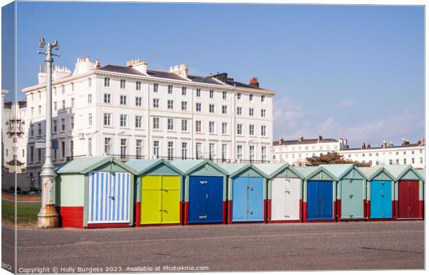 Brighton's Vibrant Waterfront: Chalets and Sea Vie Canvas Print by Holly Burgess