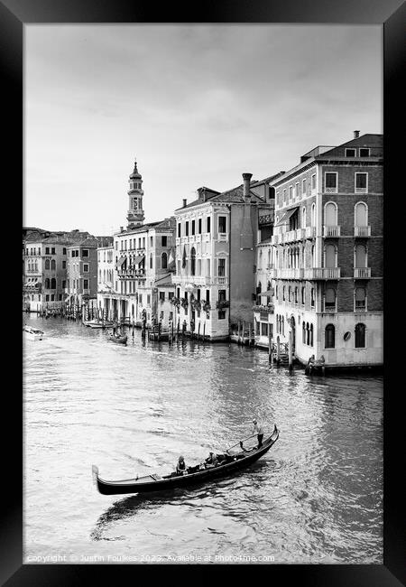 Gondolier on the Grand Canal, Venice, Italy Framed Print by Justin Foulkes