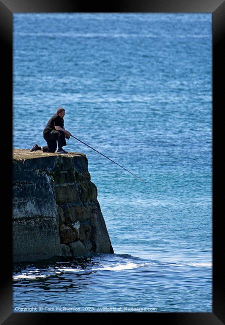 Outdoor man fishing off pier Framed Print by Tom McPherson