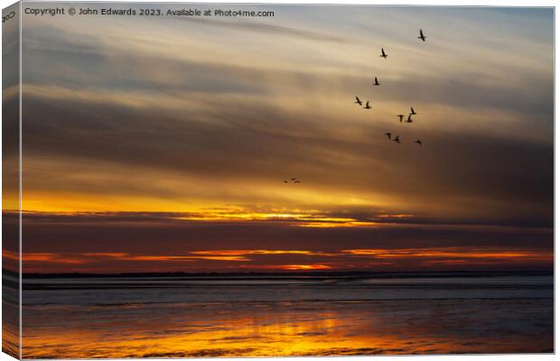 Pink-footed Geese Migration at Norfolk Sunset Canvas Print by John Edwards