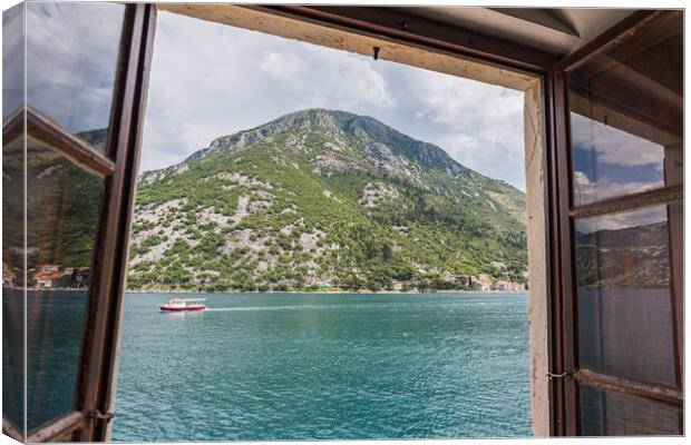Boat travels along the Bay of Kotor Canvas Print by Jason Wells