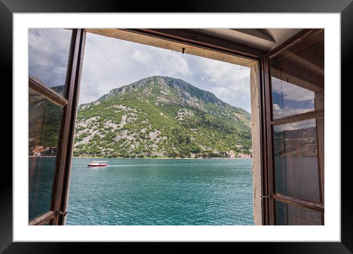 Boat travels along the Bay of Kotor Framed Mounted Print by Jason Wells