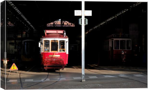 Traditional tram wagon waiting in the shade of the station in Lisbon Canvas Print by Lensw0rld 