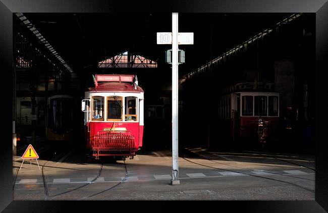 Traditional tram wagon waiting in the shade of the station in Lisbon Framed Print by Lensw0rld 