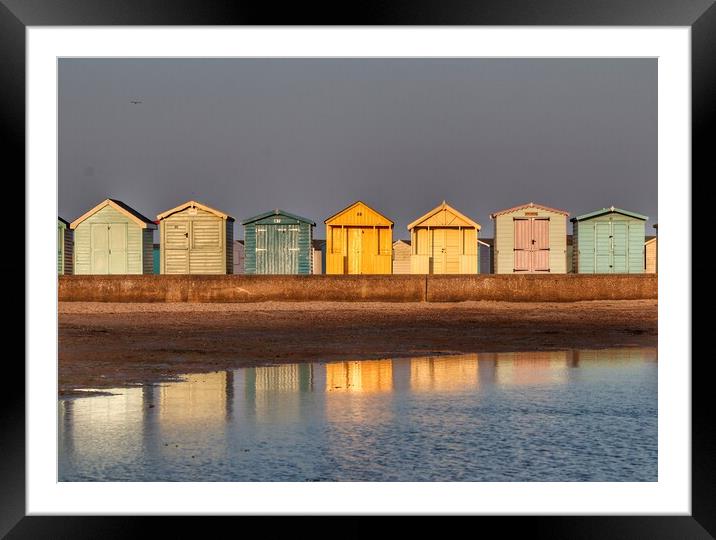 Beach huts basking in a Brightlingsea  Sunset  Framed Mounted Print by Tony lopez