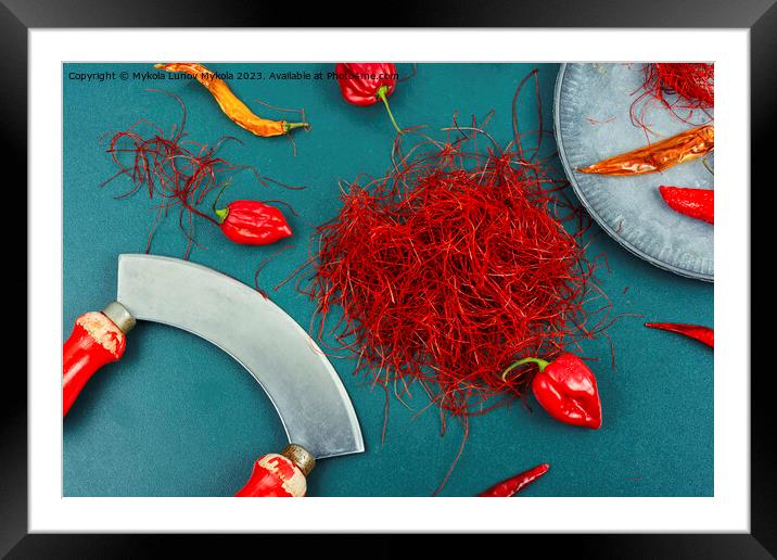 Cutting red chilly peppers. Framed Mounted Print by Mykola Lunov Mykola