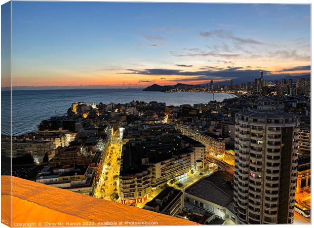 Serene Sunset over Benidorm  Canvas Print by Chris Mc Manus