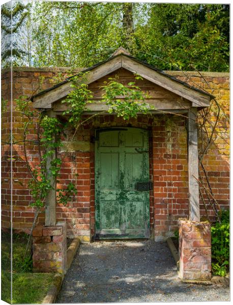 Painted green door and porch in walled garden wall Canvas Print by Steve Heap