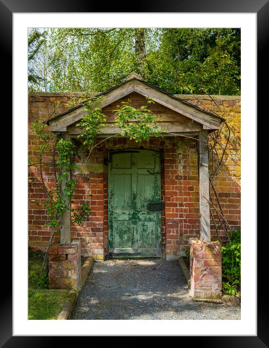 Painted green door and porch in walled garden wall Framed Mounted Print by Steve Heap