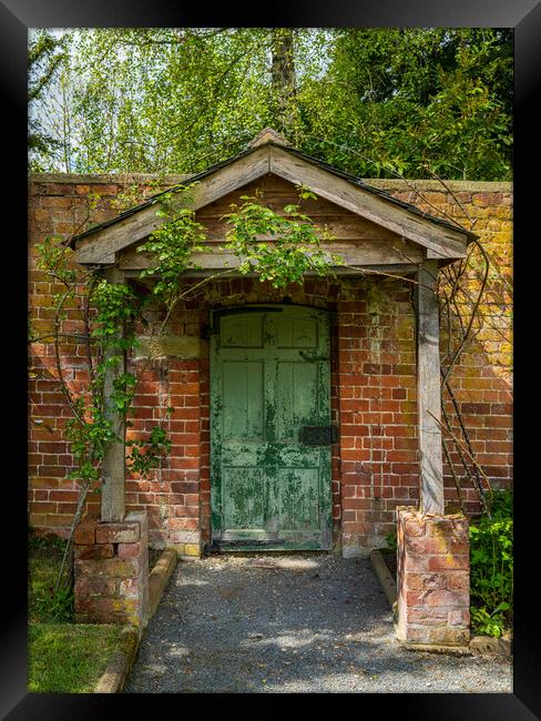 Painted green door and porch in walled garden wall Framed Print by Steve Heap