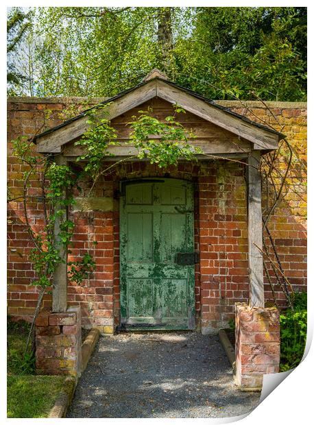 Painted green door and porch in walled garden wall Print by Steve Heap