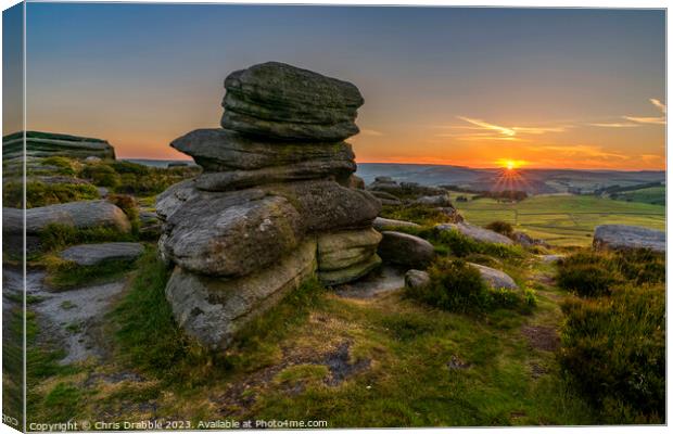 Over Owler Tor at sunset Canvas Print by Chris Drabble
