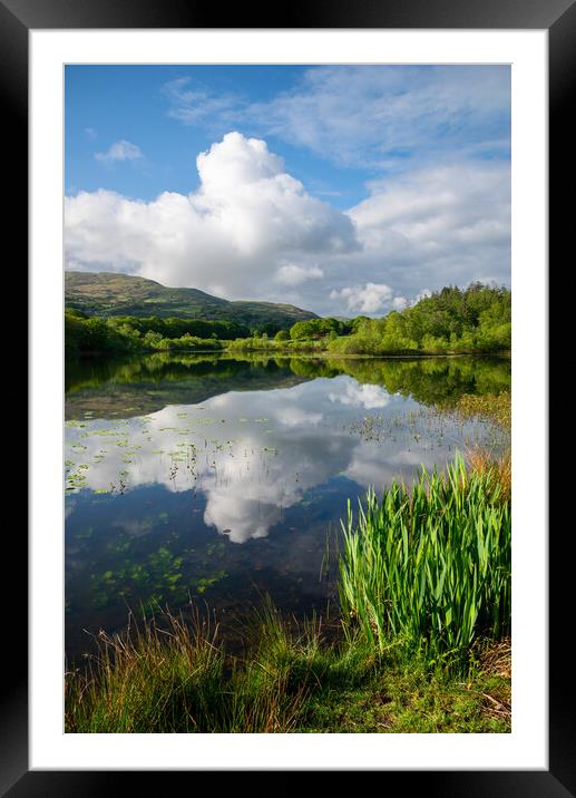 Reflections on a lake in North Wales Framed Mounted Print by Andrew Kearton