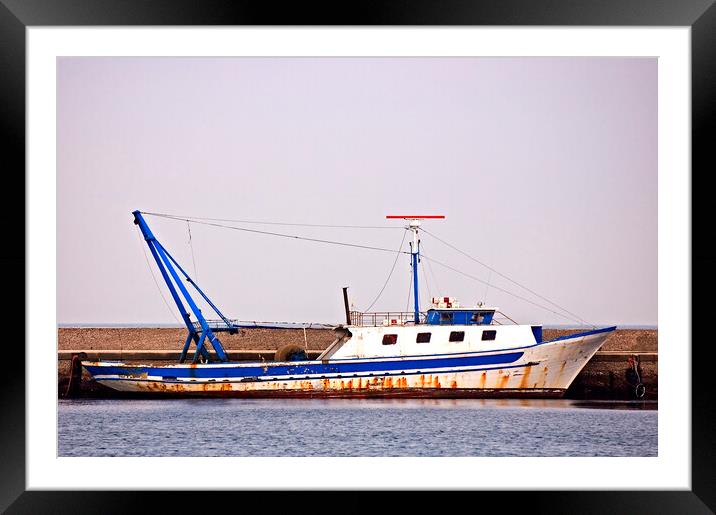 Moored fishing boat Framed Mounted Print by Massimiliano Leban