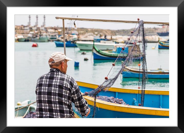 Fisherman inspecting his fishing nets Framed Mounted Print by Jason Wells