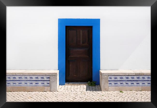 Wooden door in Ericeira, Portugal Framed Print by Lensw0rld 