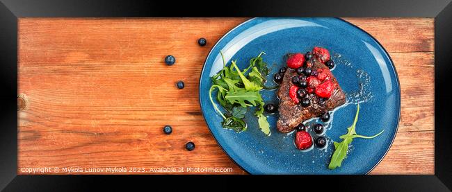 Beef steak in berry sauce on plate. Framed Print by Mykola Lunov Mykola