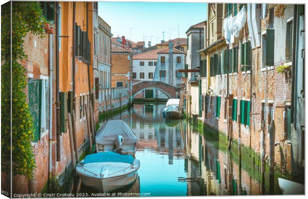 Narrow water canals in Venice. Canvas Print by Cristi Croitoru