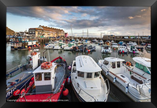 Dusk at West Bay Harbour Framed Print by Jim Monk