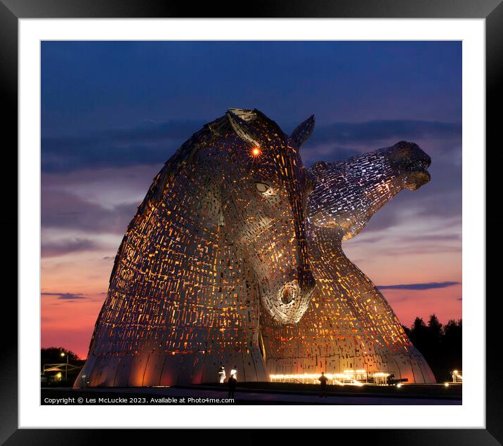The Kelpies Lights at night Framed Mounted Print by Les McLuckie
