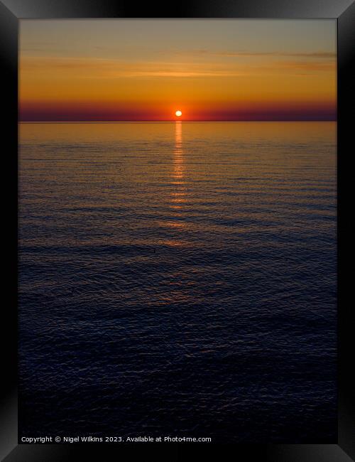 Sunrise Framed Print by Nigel Wilkins