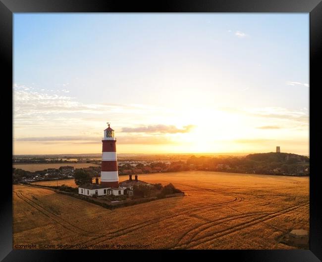 Happisburgh Lighthouse at Sunset Framed Print by Chris Spalton