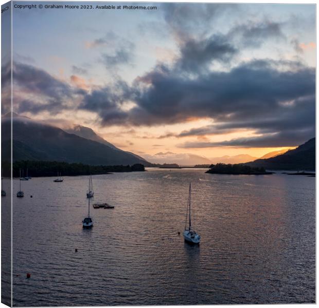 Loch Leven sunset with boats Canvas Print by Graham Moore