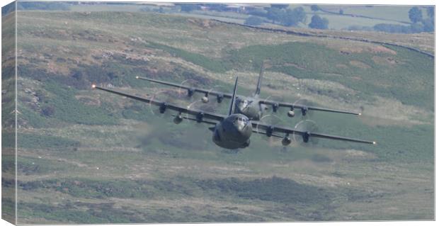 Two RAF Hercules entering the Mach Loop Canvas Print by Rory Trappe
