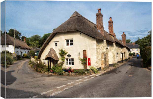 Tranquil Thatched Cottage in Branscombe Canvas Print by Rob Lester