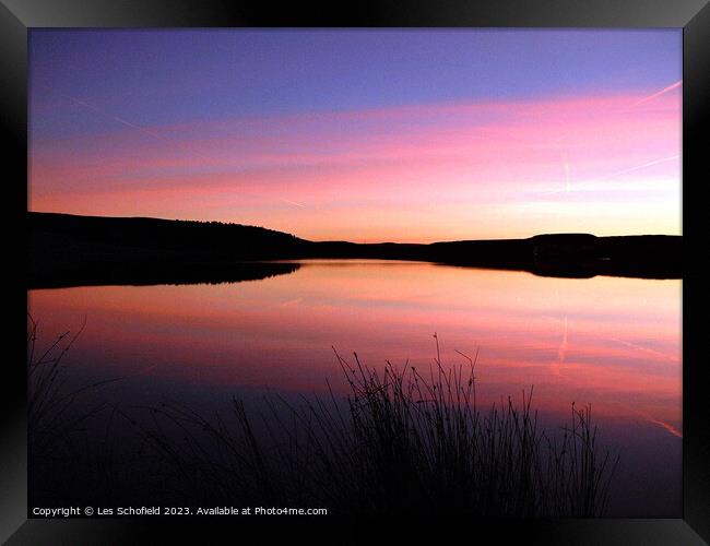 Sunset on the lake Framed Print by Les Schofield
