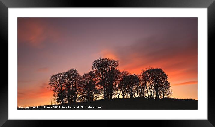 Tree silhouette at sunset Framed Mounted Print by John Barrie