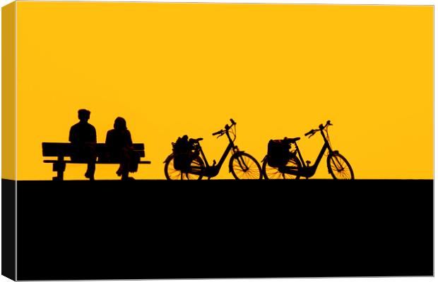 Resting Cyclists at Sunset Canvas Print by Arterra 
