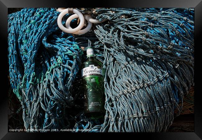 Abstract Gin bottle on fishing nets Framed Print by Tom McPherson