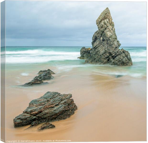 Rocks on a golden beach Canvas Print by Darrell Evans