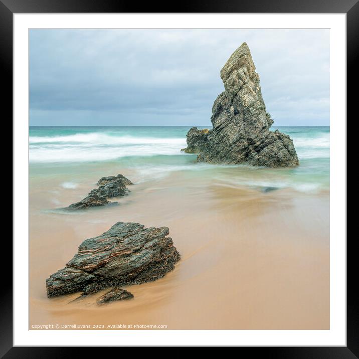Rocks on a golden beach Framed Mounted Print by Darrell Evans