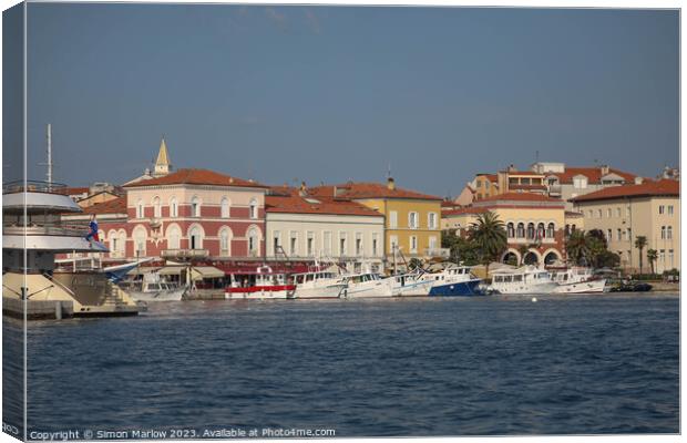 The stylish houses at the waterfront of Rovinj in  Canvas Print by Simon Marlow