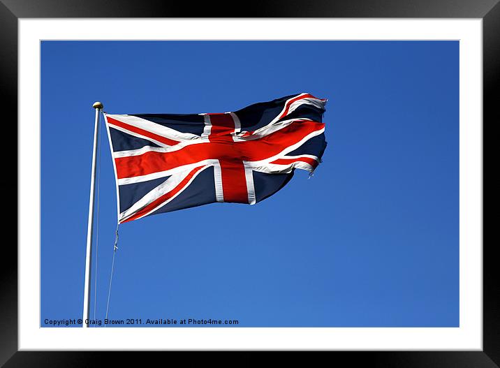 Union Jack on blue sky Framed Mounted Print by Craig Brown
