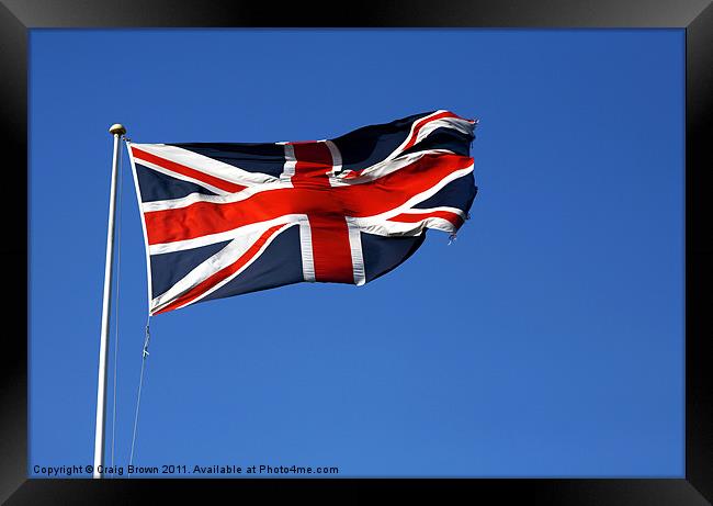 Union Jack on blue sky Framed Print by Craig Brown