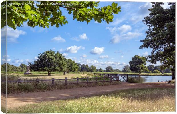 Dappled clouds on a summers morning at Bushy Park ponds Canvas Print by Kevin White