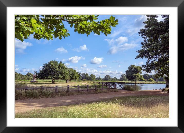 Dappled clouds on a summers morning at Bushy Park ponds Framed Mounted Print by Kevin White