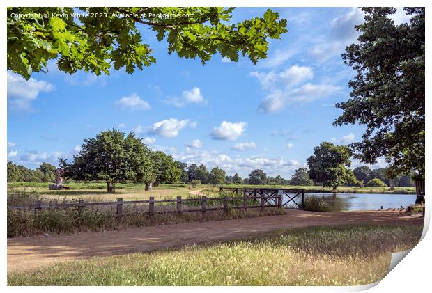 Dappled clouds on a summers morning at Bushy Park ponds Print by Kevin White