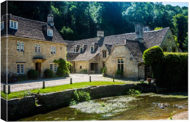 Quaint old houses in Castle Coombe, Wiltshire, UK. Canvas Print by Peter Jarvis