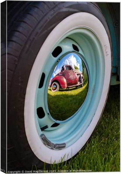 Reflection of a classic Canvas Print by David Macdiarmid