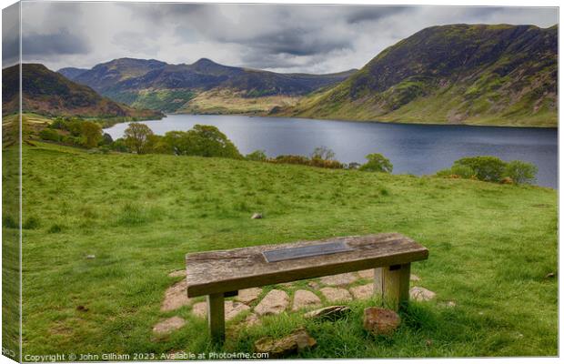 A Bench with a view over Crummock Water in the UK Lake District of Cumbria Canvas Print by John Gilham