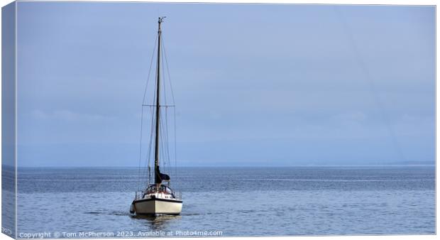 "Solitude: A Lone Yacht Sailing on the Serene Mora Canvas Print by Tom McPherson