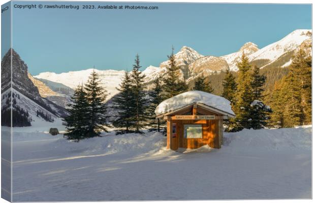 Snowy Serenity: Lake Louise and the Majestic Mountains Canvas Print by rawshutterbug 